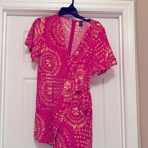 This is a romper size medium and has never been worn!